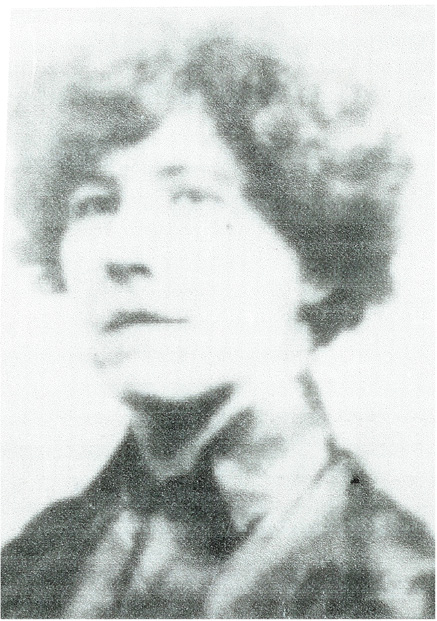 grainy, old, black and white photo of a determined looking woman
